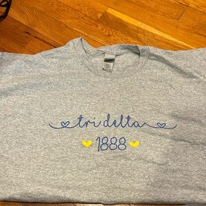 Tridelta T shirt worn once never placed in drier
